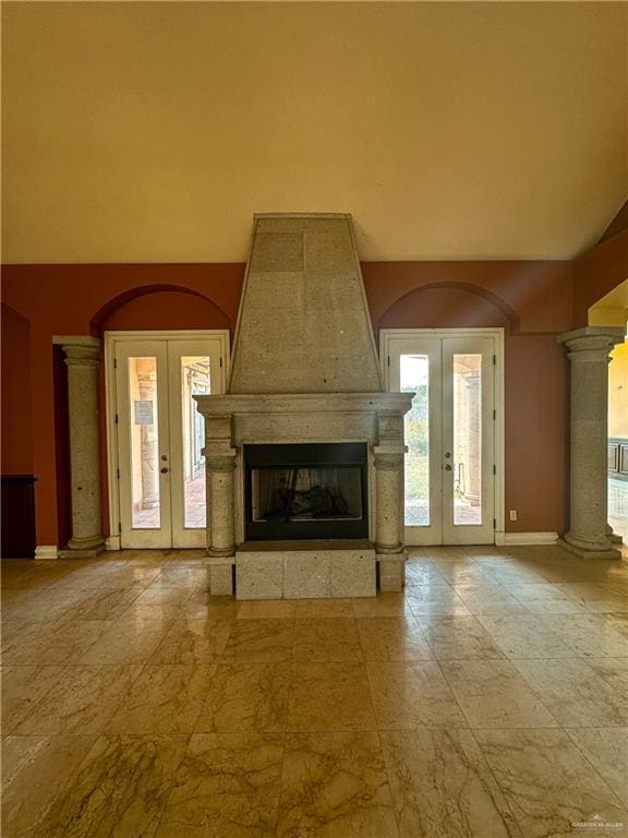 4132 Cosentino Dr, Mcallen, TX 78504 - unfurnished living room featuring french doors, a fireplace, baseboards, and arched walkways