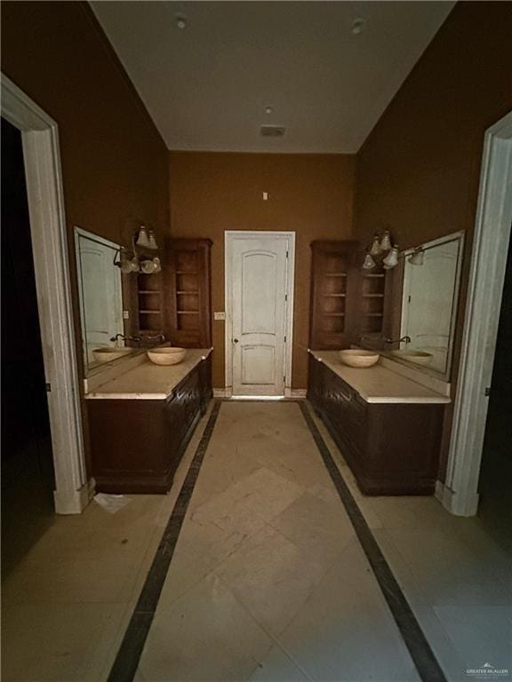 4132 Cosentino Dr, Mcallen, TX 78504 - bathroom featuring two vanities, baseboards, and a towel warming rack