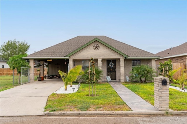 view of front facade featuring a front yard and a carport