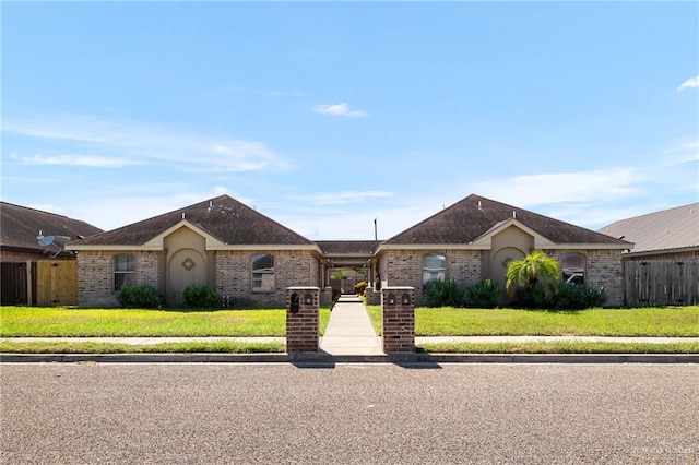 single story home featuring a front yard