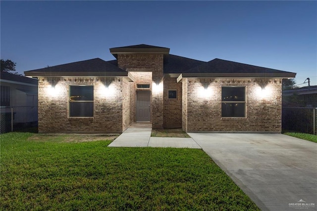 view of front of property with a yard