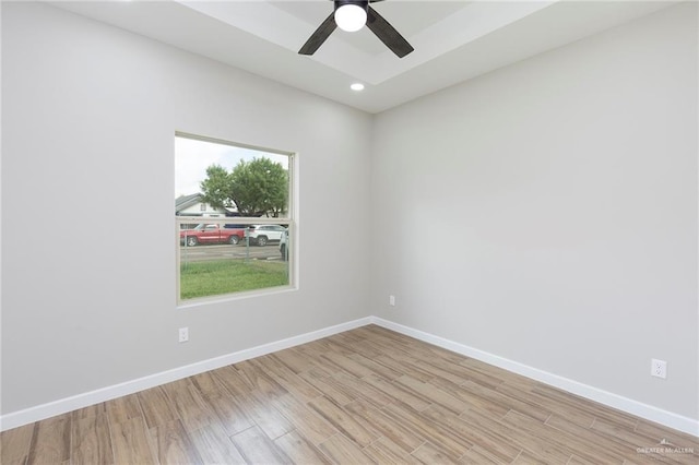 unfurnished room with ceiling fan and light hardwood / wood-style floors