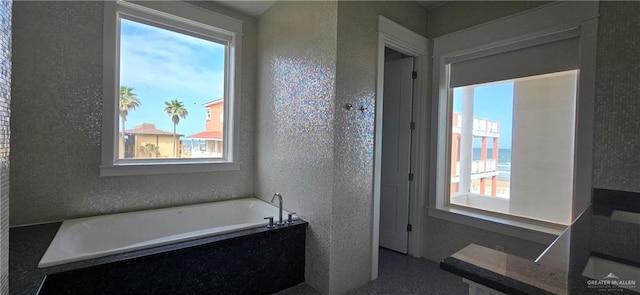 6518 Beach Dr, South Padre Island, TX 78597 - bathroom with plenty of natural light and a bath