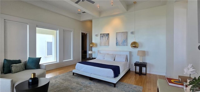 6518 Beach Dr, South Padre Island, TX 78597 - bedroom with wood finished floors and beamed ceiling