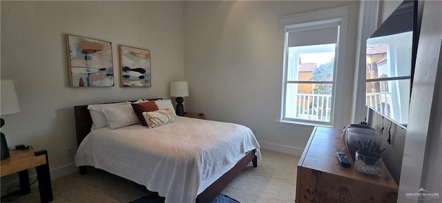 6518 Beach Dr, South Padre Island, TX 78597 - bedroom with baseboards and carpet