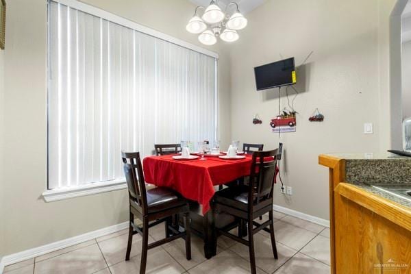 1501 Lookout St, Edinburg, TX 78541 - dining room featuring light tile patterned flooring, a chandelier, and baseboards