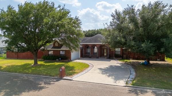 1501 Lookout St, Edinburg, TX 78541 - view of front of home with concrete driveway and an attached garage