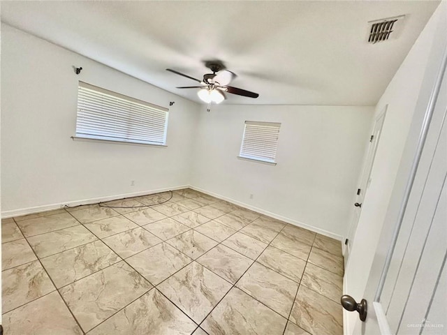 unfurnished room with baseboards, a ceiling fan, marble finish floor, and visible vents