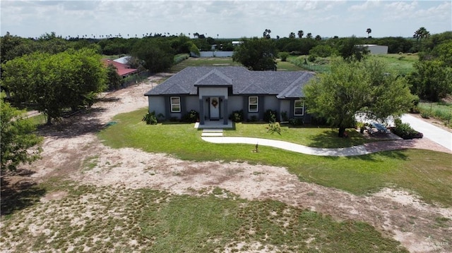 16311 Citrus Dr, Mcallen, TX 78541 - single story home featuring a front lawn, stucco siding, and dirt driveway