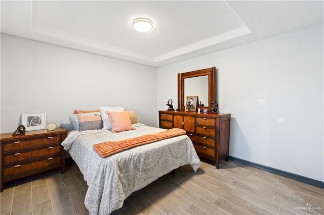 16311 Citrus Dr, Mcallen, TX 78541 - bedroom with a raised ceiling and wood finish floors