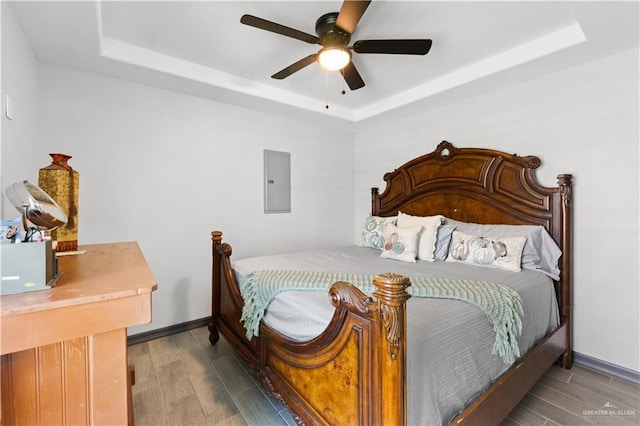16311 Citrus Dr, Mcallen, TX 78541 - bedroom featuring a raised ceiling, wood finished floors, and electric panel