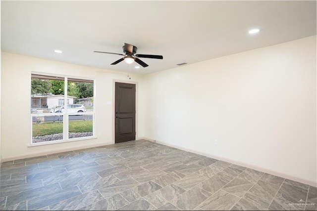 empty room featuring ceiling fan