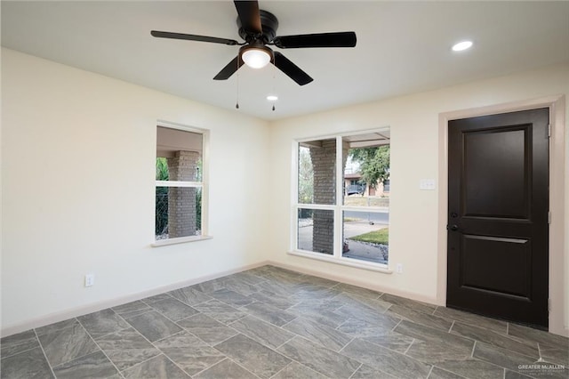 unfurnished room featuring ceiling fan