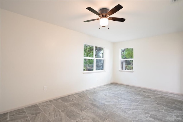 unfurnished room featuring ceiling fan