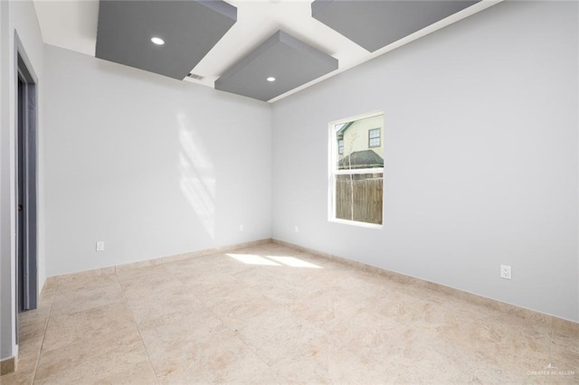 unfurnished room with visible vents and recessed lighting