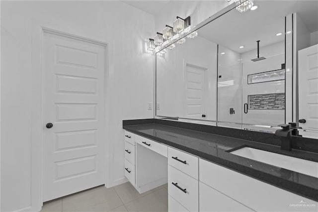 bathroom featuring tile patterned floors, recessed lighting, a stall shower, and vanity