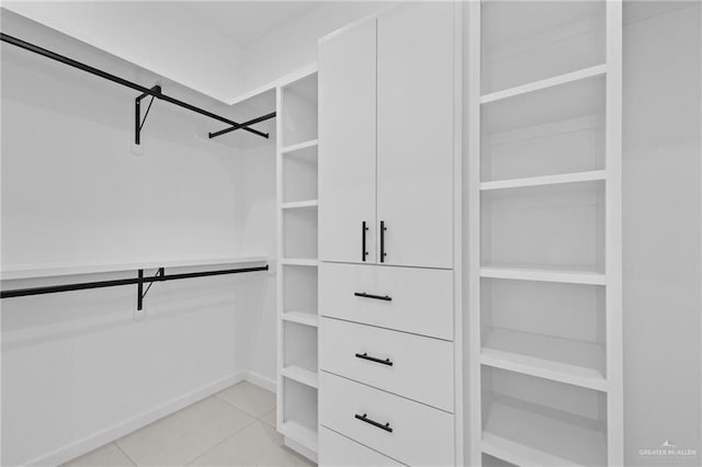 walk in closet featuring light tile patterned floors