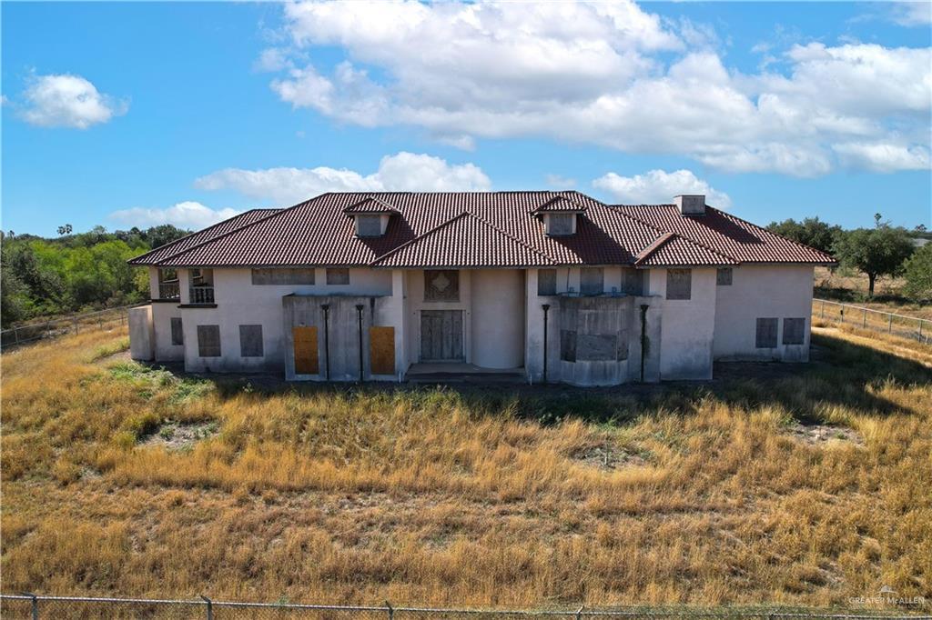 2136 E Mile 3rd Rd, Palmhurst, TX 78573 - mediterranean / spanish house with stucco siding and a tiled roof