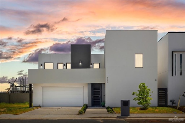 contemporary house featuring driveway and stucco siding