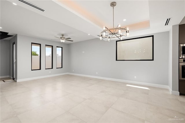 unfurnished room featuring a tray ceiling, recessed lighting, visible vents, ceiling fan, and baseboards