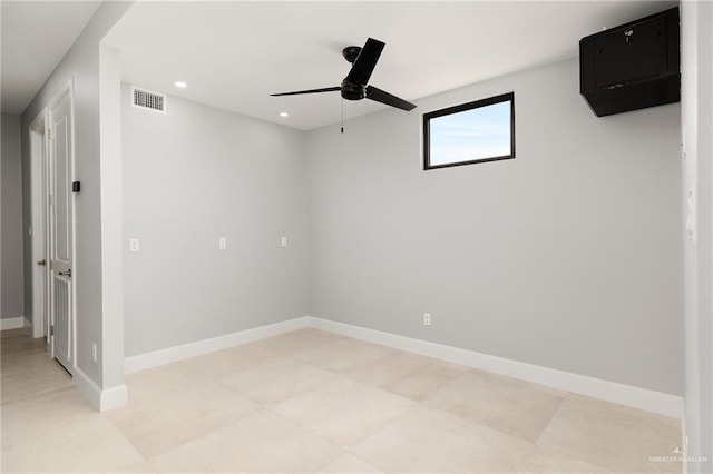 spare room featuring recessed lighting, visible vents, and baseboards