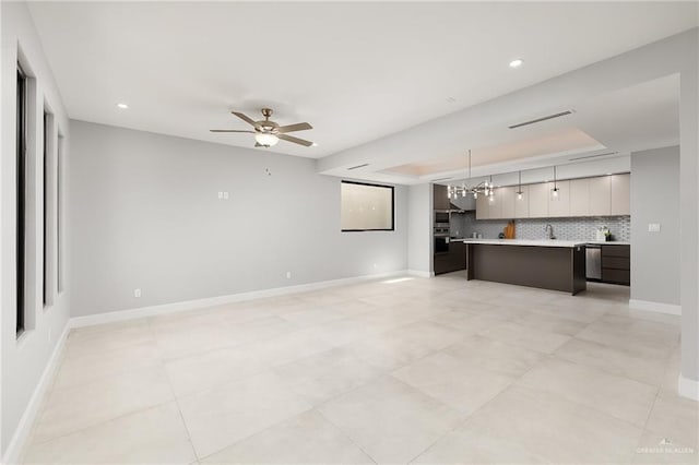 unfurnished living room with baseboards, visible vents, ceiling fan, and recessed lighting