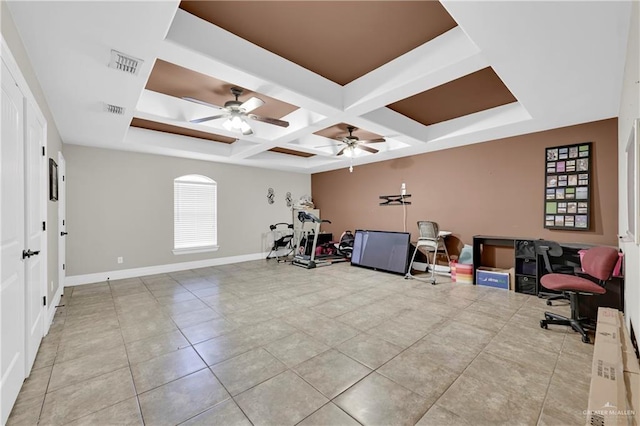 workout area featuring light tile patterned floors, ceiling fan, and coffered ceiling