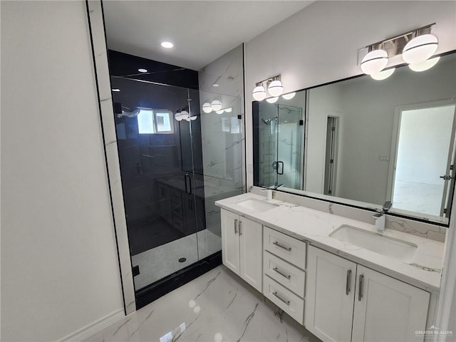 bathroom with vanity and a shower with door