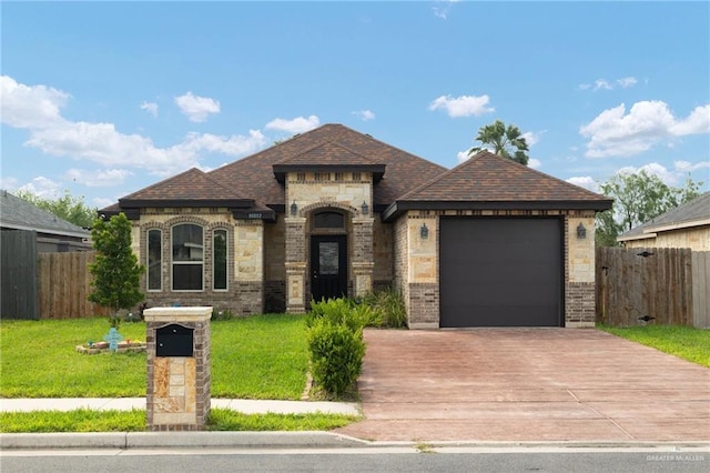 10312 N 31st St, Mcallen, TX 78504 - french country inspired facade featuring concrete driveway, a garage, and brick siding