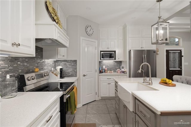 10312 N 31st St, Mcallen, TX 78504 - kitchen featuring appliances with stainless steel finishes, a sink, light countertops, and light marble finish flooring