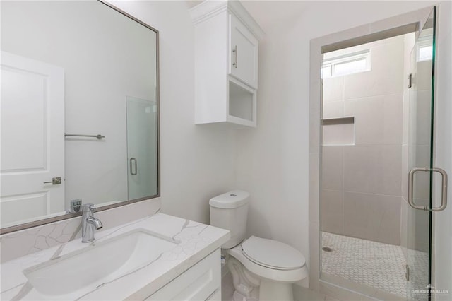 701 Helen St, Mission, TX 78574 - bathroom with a stall shower, toilet, and vanity