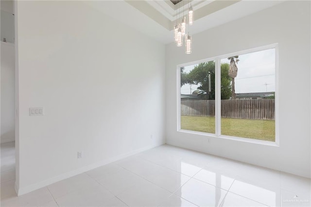 701 Helen St, Mission, TX 78574 - unfurnished room featuring light tile patterned flooring, baseboards, and a chandelier
