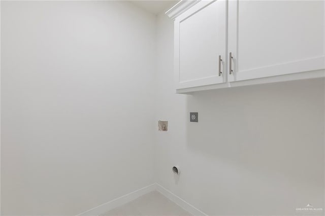 701 Helen St, Mission, TX 78574 - laundry room featuring hookup for an electric dryer, cabinet space, baseboards, and hookup for a washing machine