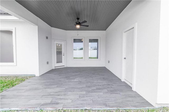 view of patio featuring ceiling fan