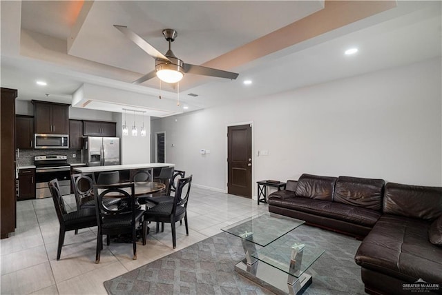 3017 S L St Unit C, Mcallen, TX 78503 - living room featuring ceiling fan, light tile patterned floors, recessed lighting, and a tray ceiling