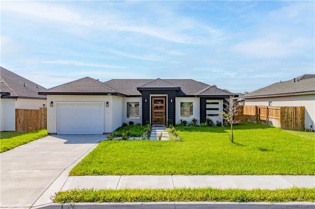 view of front of house featuring a garage and a front yard