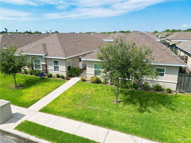 single story home with a front yard