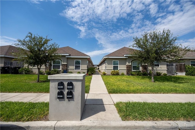 view of front of home with a front lawn