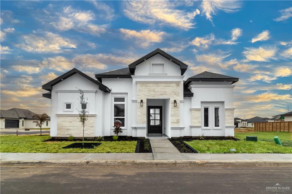 view of front of house with a yard