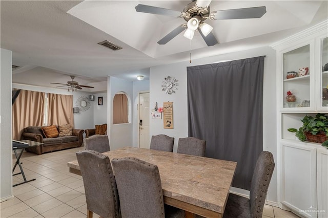 6402 S Mars Ln, Pharr, TX 78577 - dining area featuring a ceiling fan, visible vents, light tile patterned flooring, built in shelves, and arched walkways