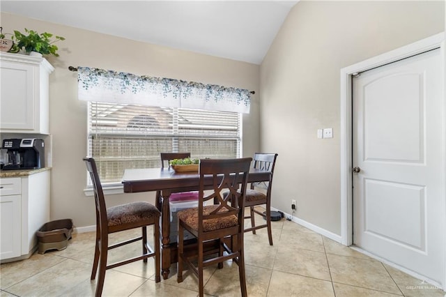 2003 N 44th Ln, Mcallen, TX 78501 - dining area featuring vaulted ceiling, light tile patterned floors, and baseboards