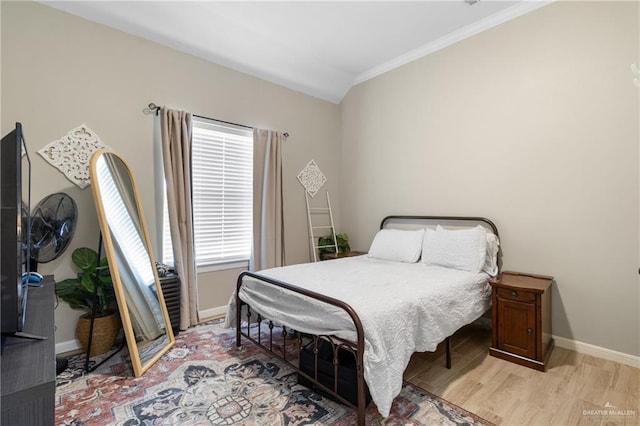 2003 N 44th Ln, Mcallen, TX 78501 - bedroom featuring ornamental molding, baseboards, and light wood-style floors
