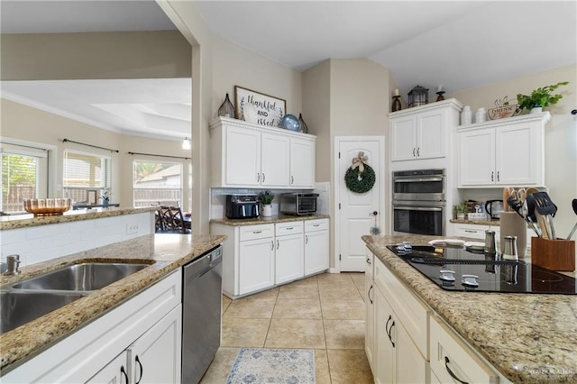 2003 N 44th Ln, Mcallen, TX 78501 - kitchen with stainless steel appliances, white cabinets, light tile patterned floors, light stone counters, and decorative backsplash