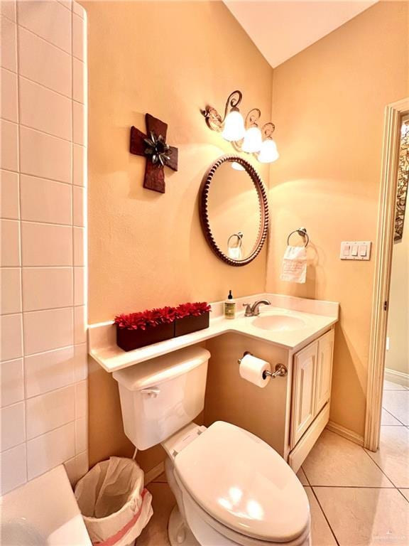 bathroom with vanity, tile patterned floors, and toilet