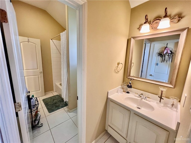 bathroom with lofted ceiling, vanity, tile patterned floors, and shower / bath combination with curtain