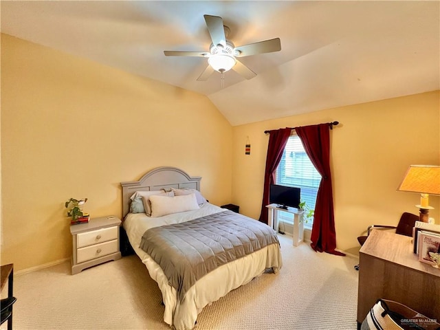 bedroom with ceiling fan, lofted ceiling, and light carpet