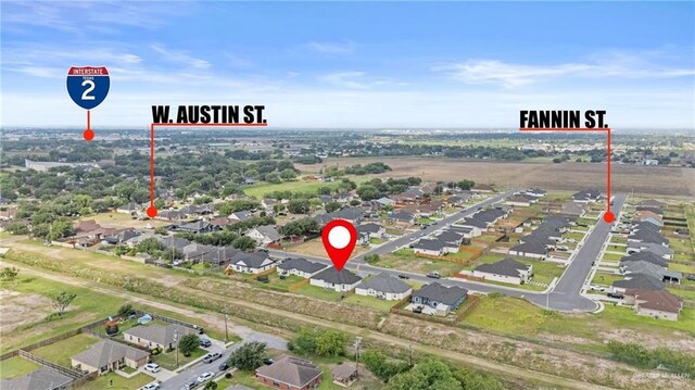 3108 Travis St, Weslaco, TX 78599 - aerial overview of property's location featuring nearby suburban area