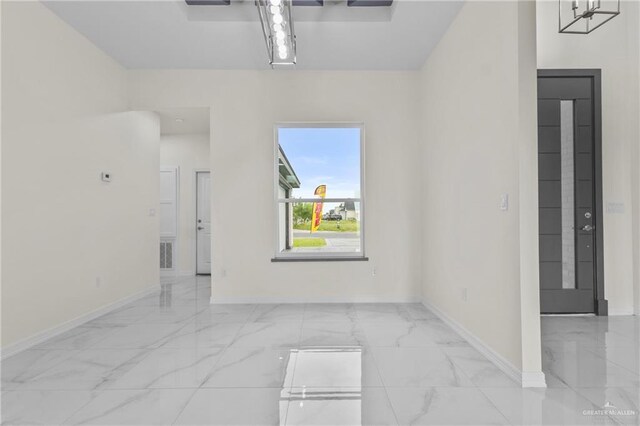 3108 Travis St, Weslaco, TX 78599 - spare room with light marble finish floors and baseboards