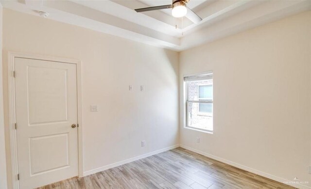 unfurnished room featuring ceiling fan and light wood-type flooring