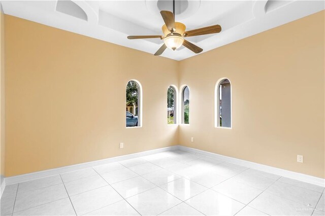 3210 Salvador Ave, Edinburg, TX 78539 - unfurnished room featuring ceiling fan, light tile patterned flooring, and baseboards